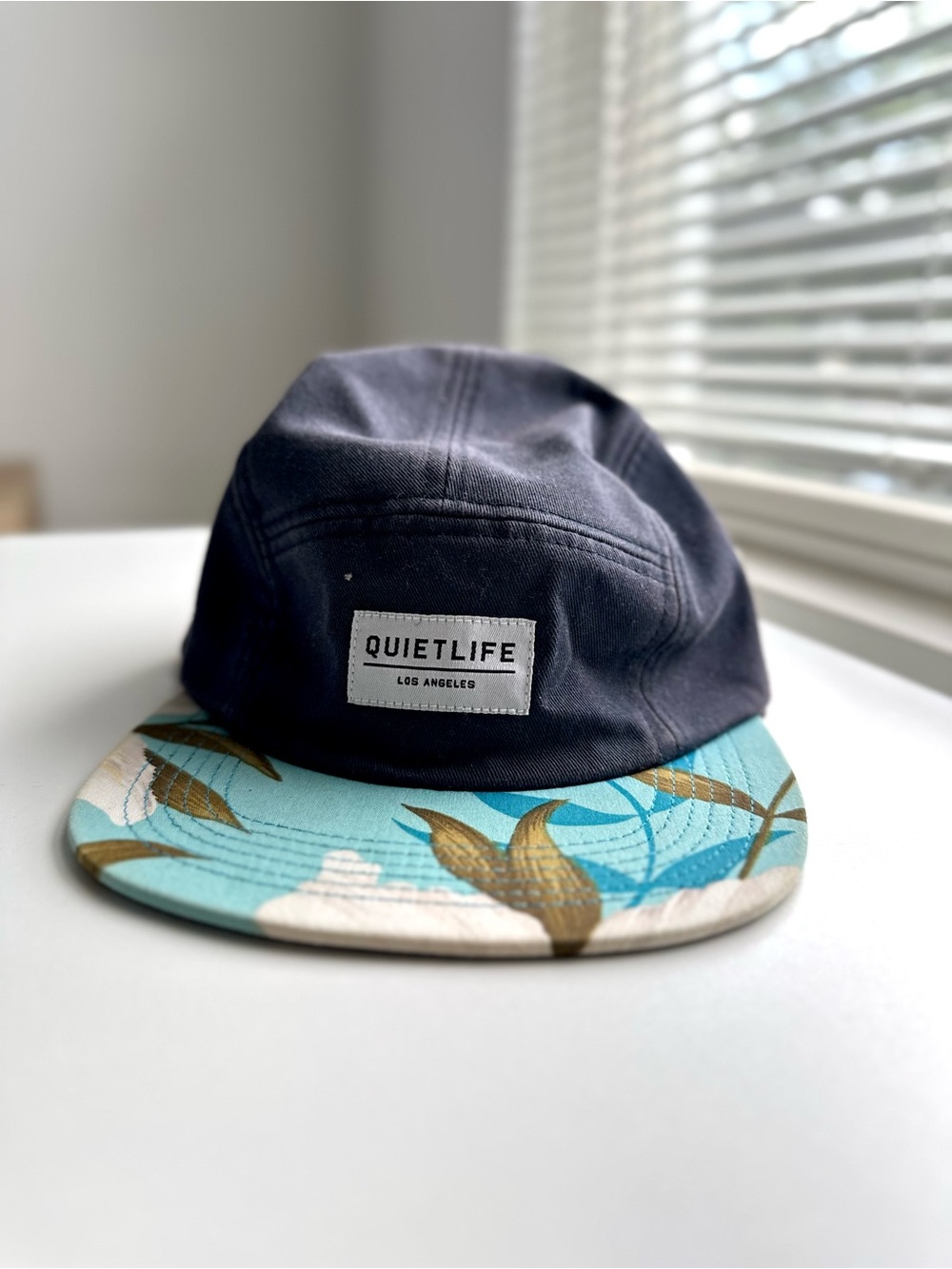 The Quiet Life 5-Panel Camp Hat with Blue Floral Brim